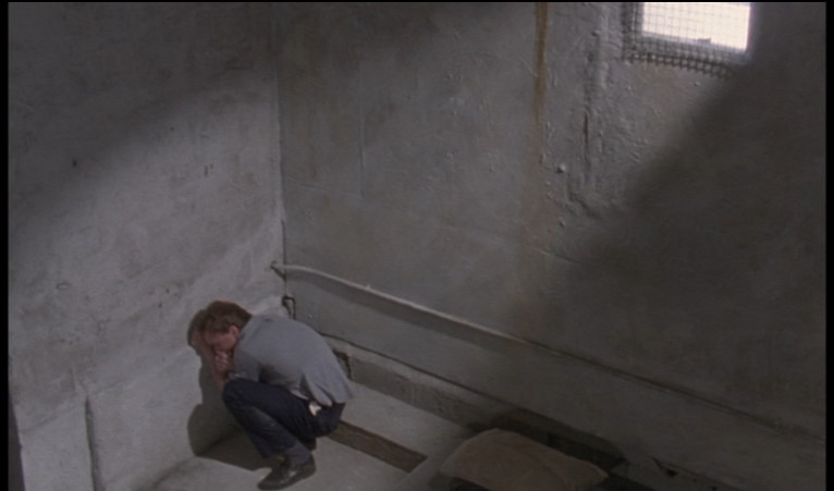 Clean, Shaven, Peter huddled in a corner